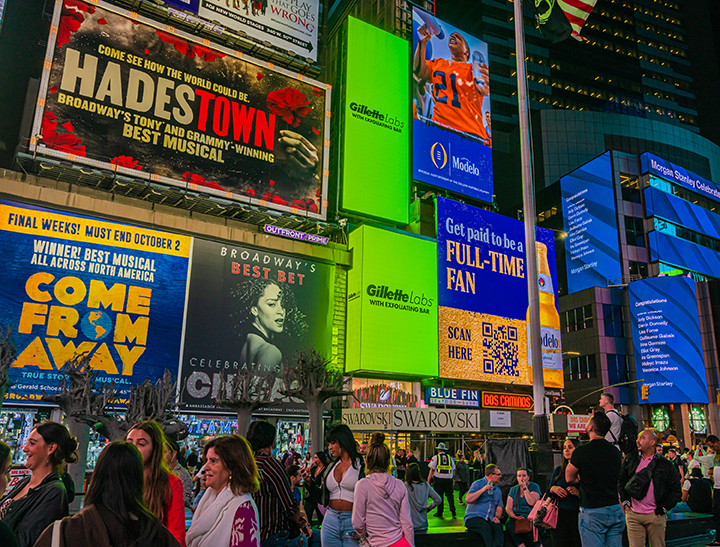 A view of two digital screens in Times Square directly above the Swarovski store